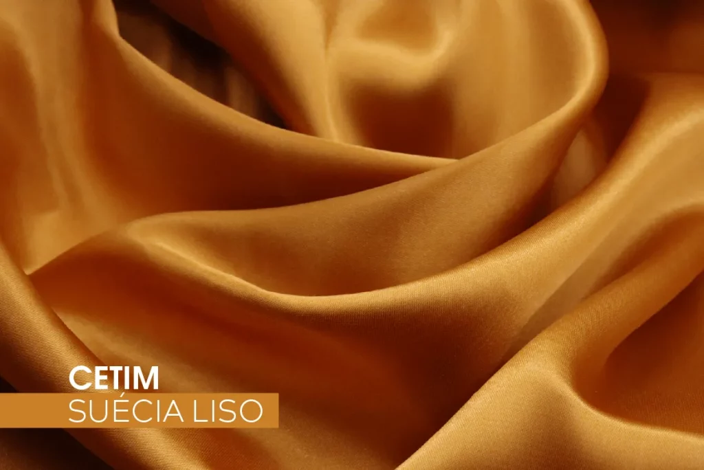 Tecido Cetim Suécia Liso dourado, com brilho acetinado e toque macio, ideal para moda feminina sofisticada