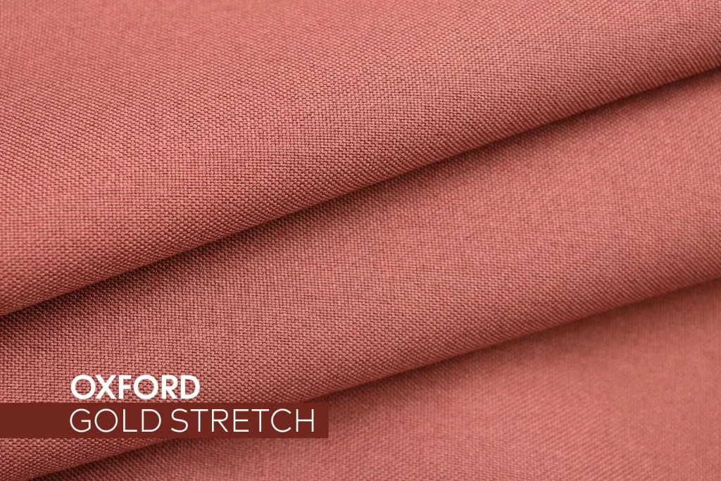 Tecido Oxford Gold Stretch em tom terroso, com textura encorpada e leve elasticidade para uniformes profissionais.